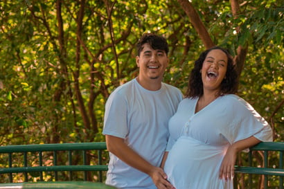 Pregnant couple in nature